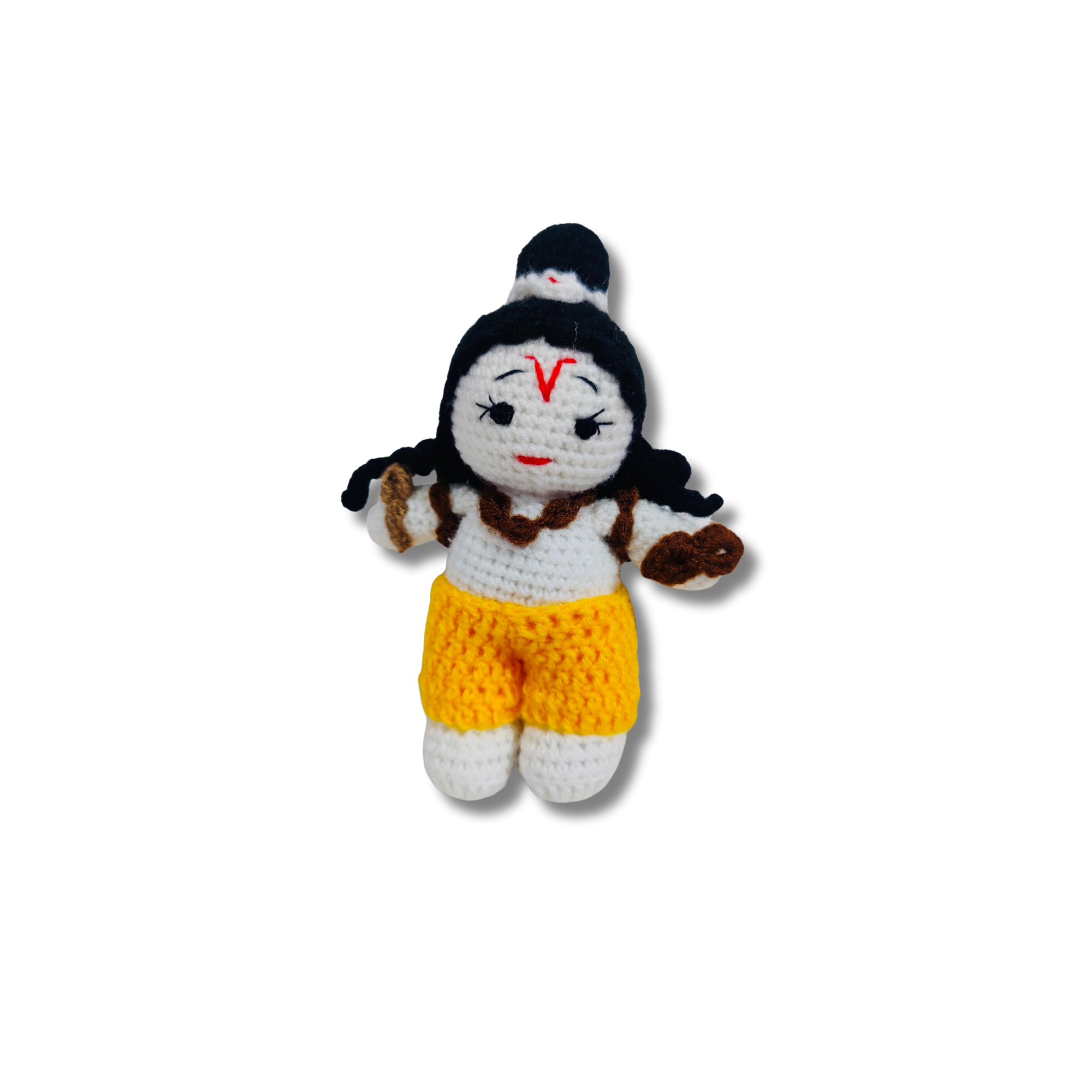 Small crochet doll with black hair, white face, and yellow shorts on a white background
